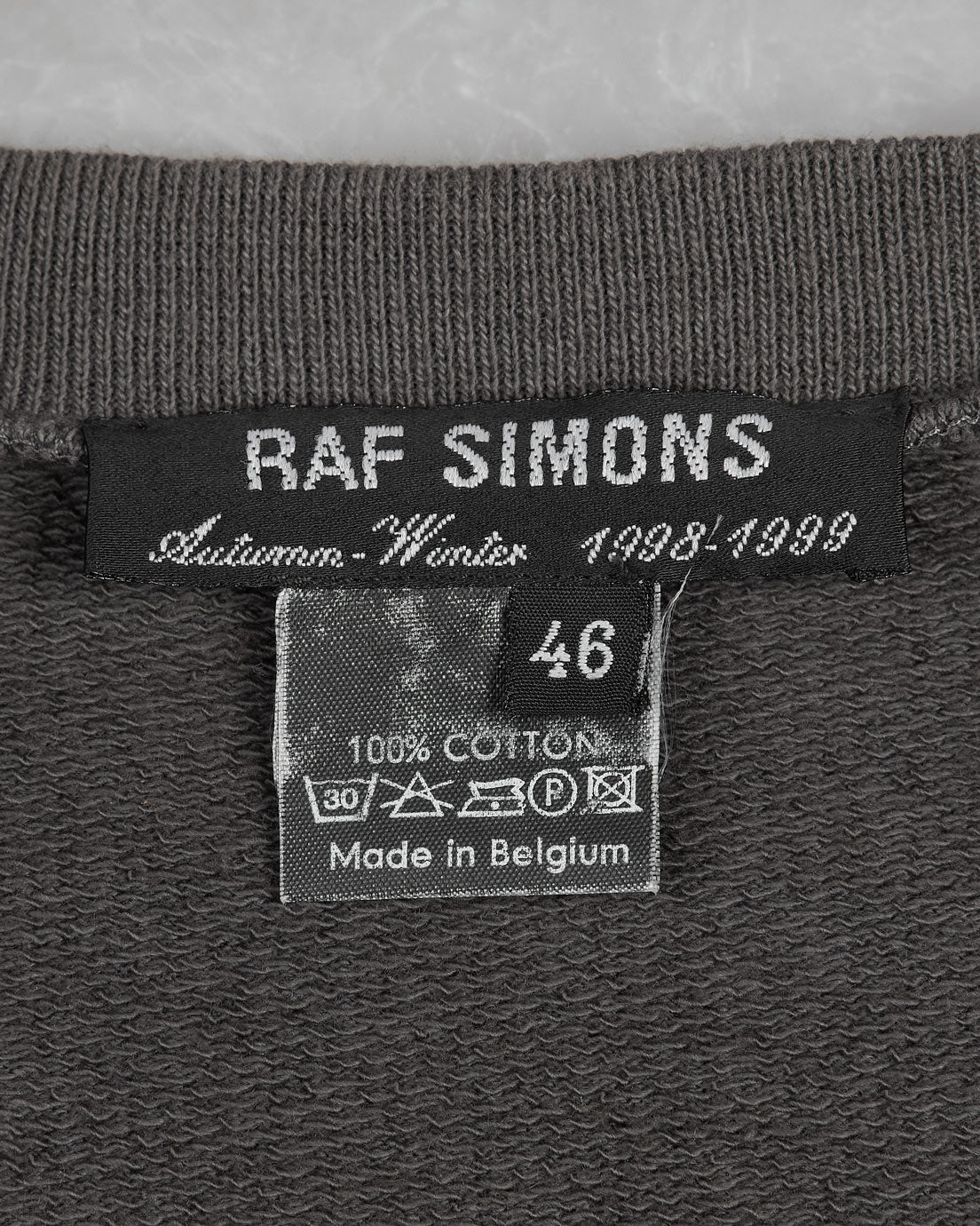 Raf Simons “Radioactivity” Raglan Sweatshirt tag
