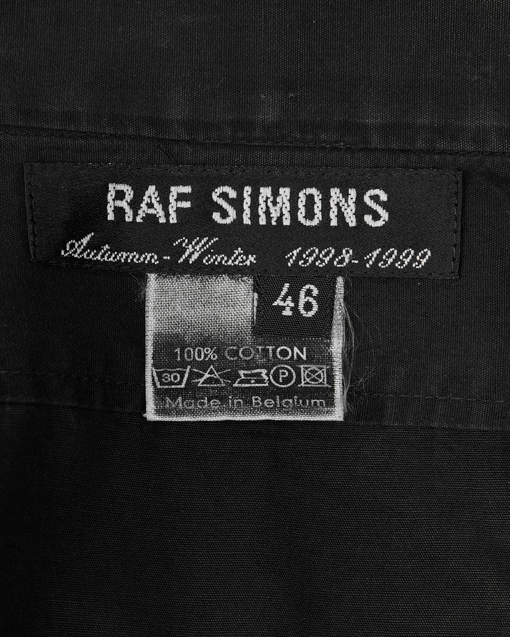 Raf Simons Black Wing Tip Shirt - AW98 "Radioactivity" tag detail photo